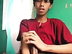 Young Asian Man Masturbating In Bed.